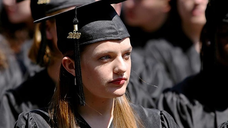 Zoey at ceremony in cap and gown 