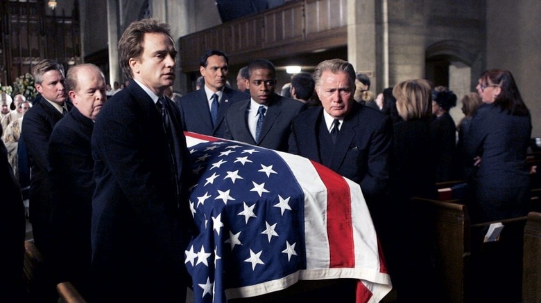 Josh, Bartlet, Charlie, and Santos carrying Leo's coffin