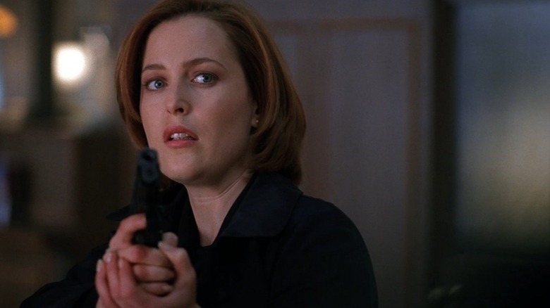 Scully pointing gun