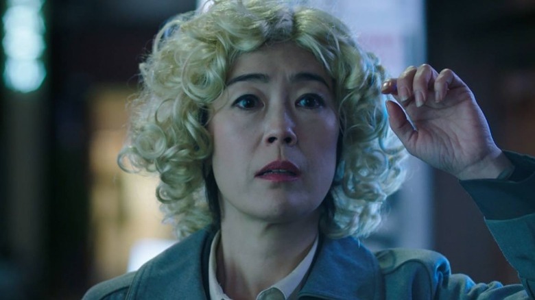 Setsuko/Lucy wearing blonde wig