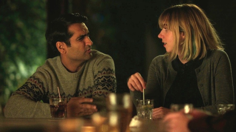 Kumail and Emily at bar counter, speaking