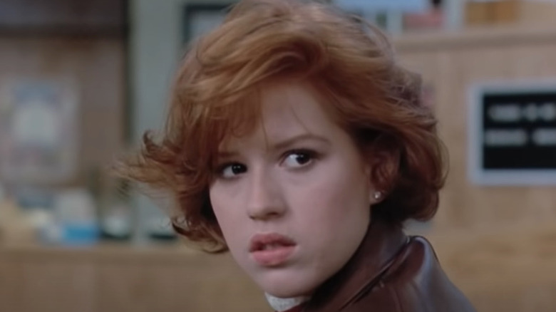 Molly Ringwald looks behind her