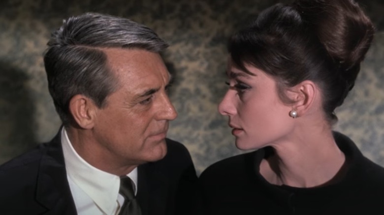 Audrey Hepburn and Cary Grant look into each other's eyes