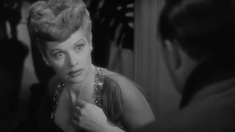 Lucille Ball looks at a man in fear