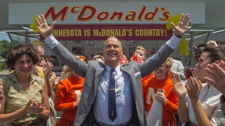 Ray Kroc raises his arms