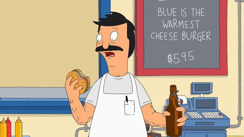 bob holding burger and beer