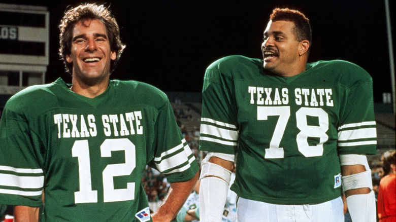 Scott Bakula and Sinbad in football uniforms