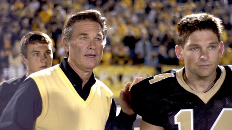 Kurt Russell coaching a football player