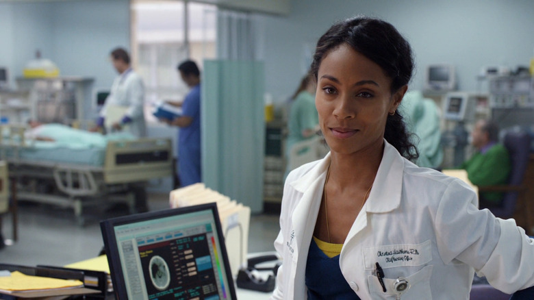 Dr. Hawthorn stands in front of a computer