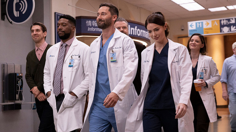 Goodwin and his team walk through a hospital hallway