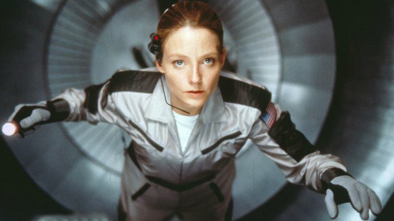 Jodi Foster floats in a spacecraft