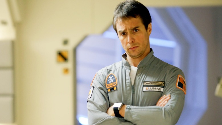 Sam Rockwell folds his arms