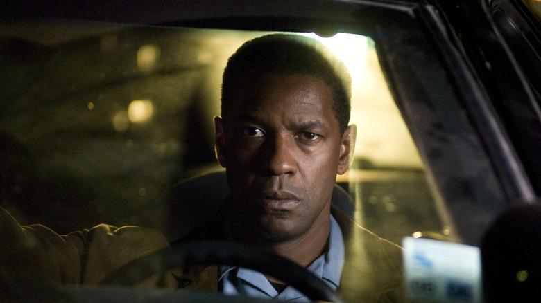 Denzel sitting in car