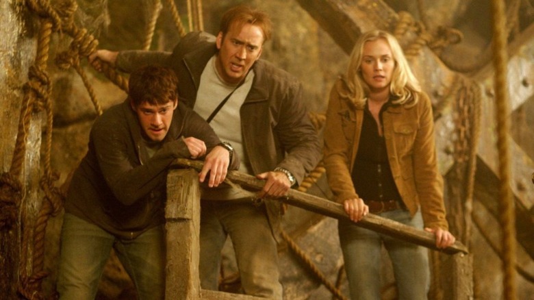 Justin Bartha, Nicholas Cage, and Diane Kruger in underground cavern