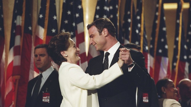 Streep and Schrieber dancing in front of American flags