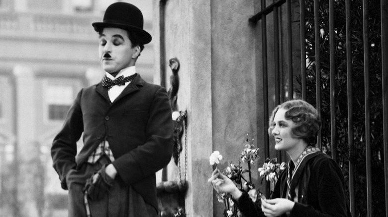 Virginia Cherrill offers Charlie Chaplin a flower