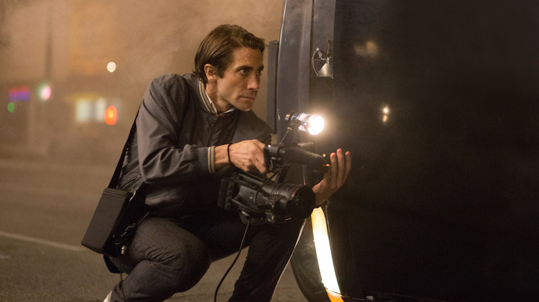 Jake Gyllenhaal holds camera