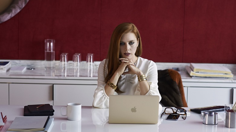 Amy Adams looks at computer