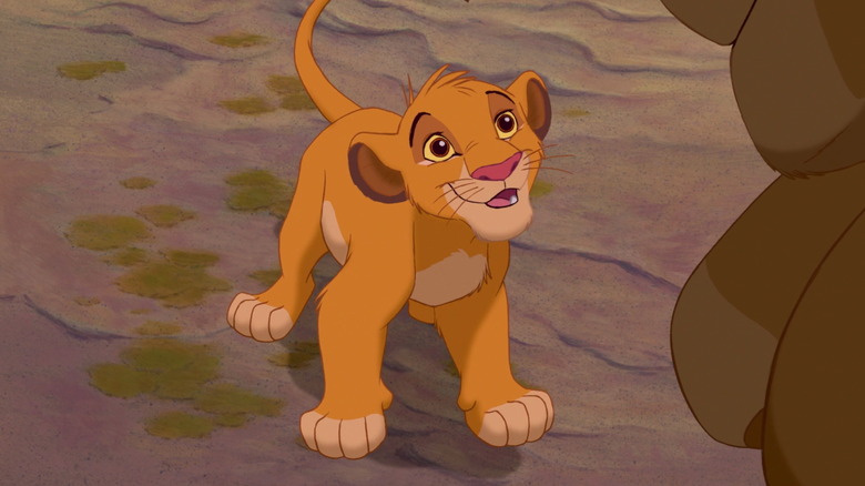 Young Simba looks up smiling