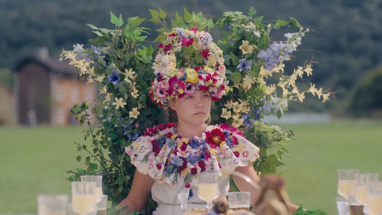 Dani sits at the head of the table as May Queen