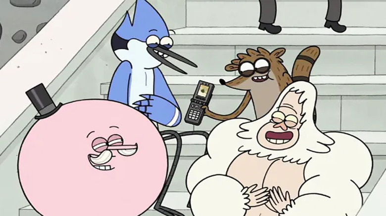 Mordecai and Rigby showing a video to Pops and Skips