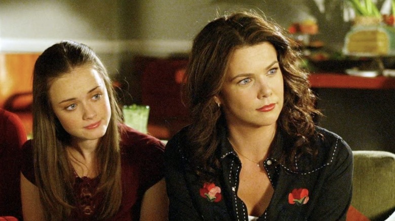 Rory and Lorelai sitting on couch