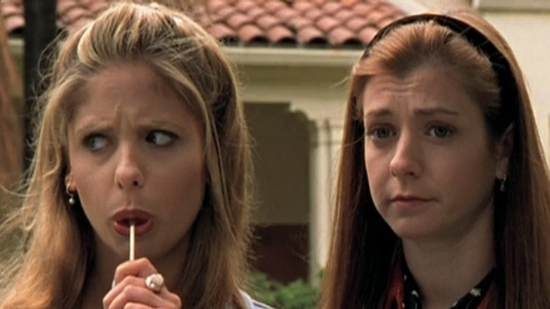 Buffy with lollipop next to Willow