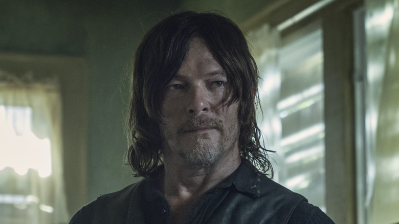 Daryl standing in house