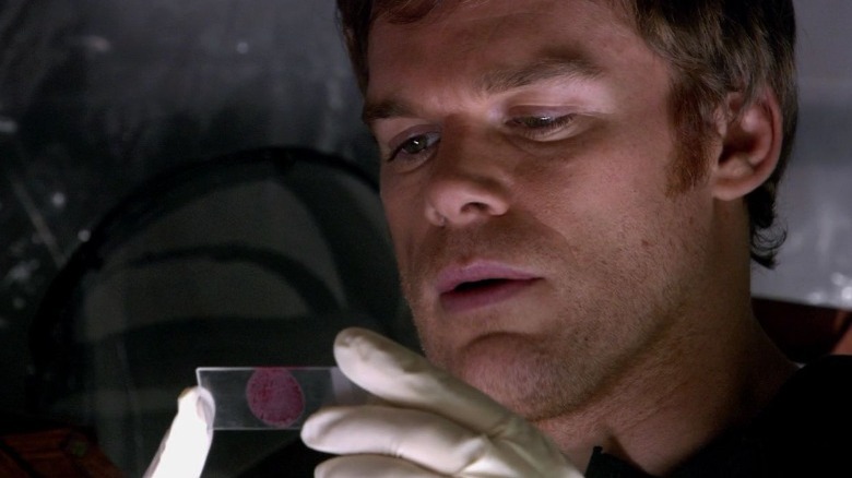 Dexter Morgan examining blood