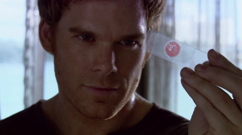 Dexter examining a sample