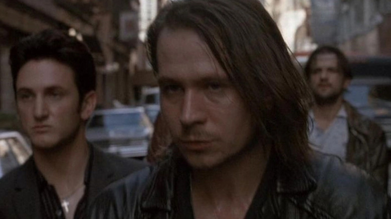 Gary Oldman and Shawn Penn walk through the street