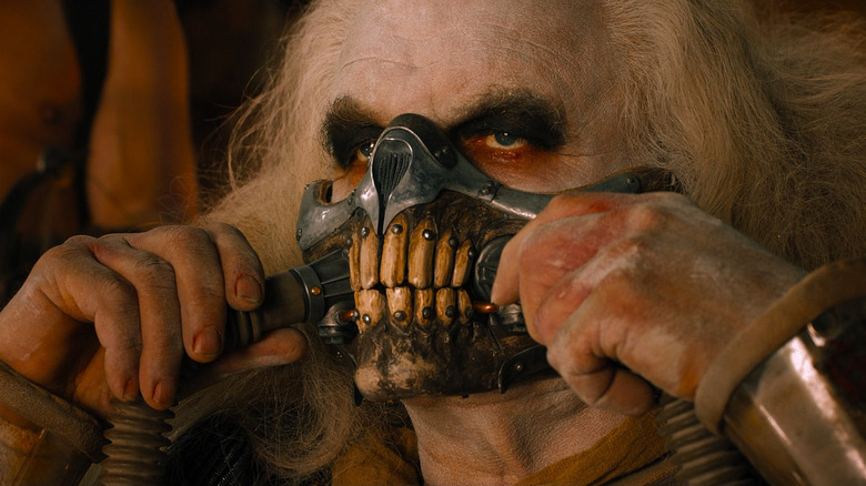 Immortan Joe dons mask