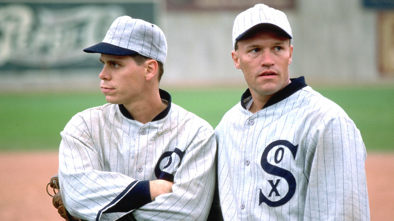 Two White Sox stand on the field