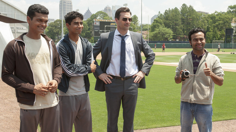 Hamm and players stand on the field