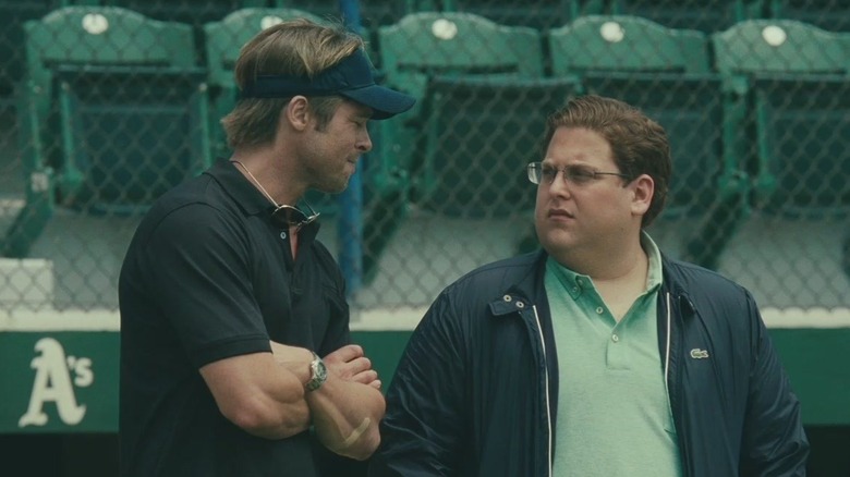 Beane and Brandt talk on the field