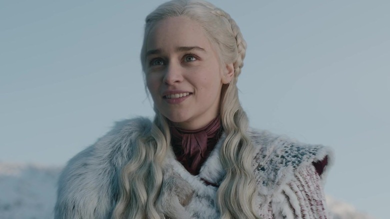 Daenerys Targaryen smiling in white coat