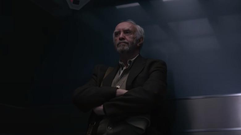 Jonathan Pryce in dark room