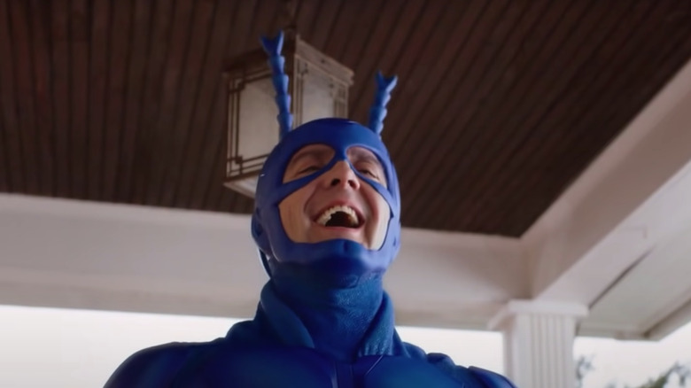 The Tick laughing on porch