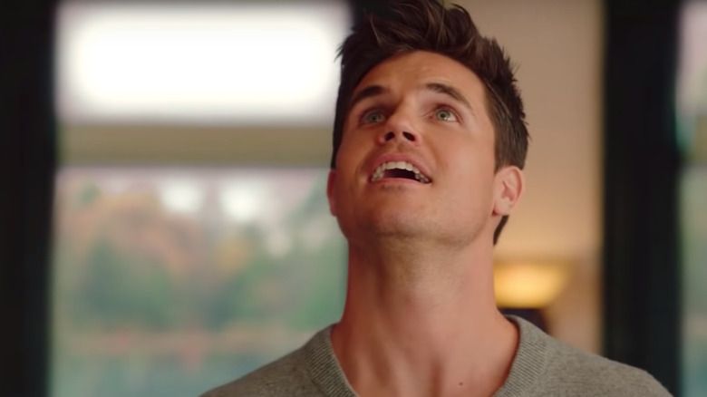 Robbie Amell looking up