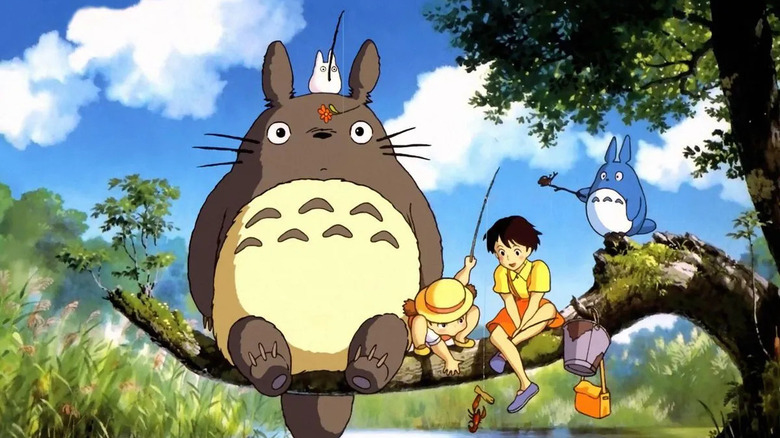The girls play with forest spirits in My Neighbor Totoro