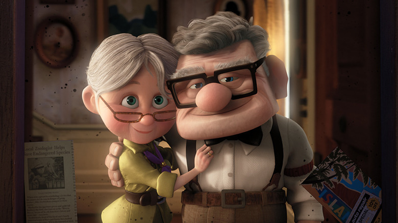 Ellie and Carl pose for a picture in Up