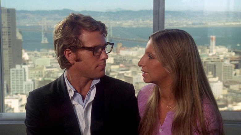 Ryan O'Neal and Barbra Streisand talking