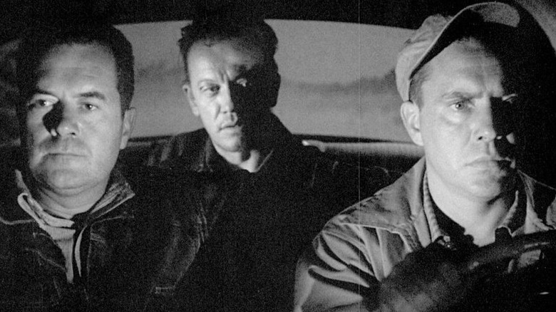 Roy, Gilbert, and Emmett in a car