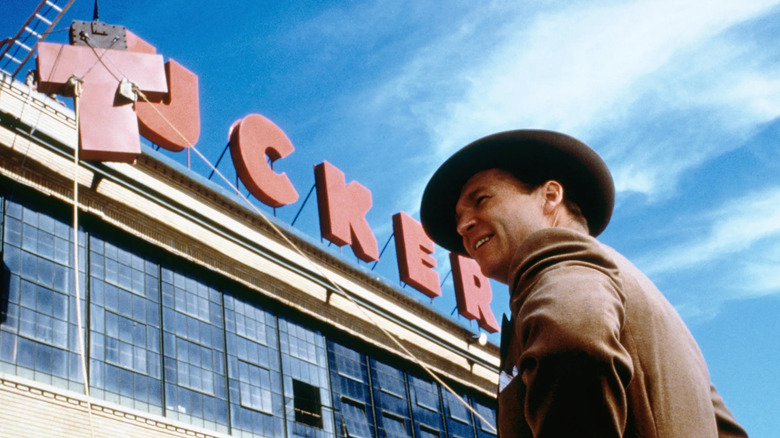 Tucker in front of his building