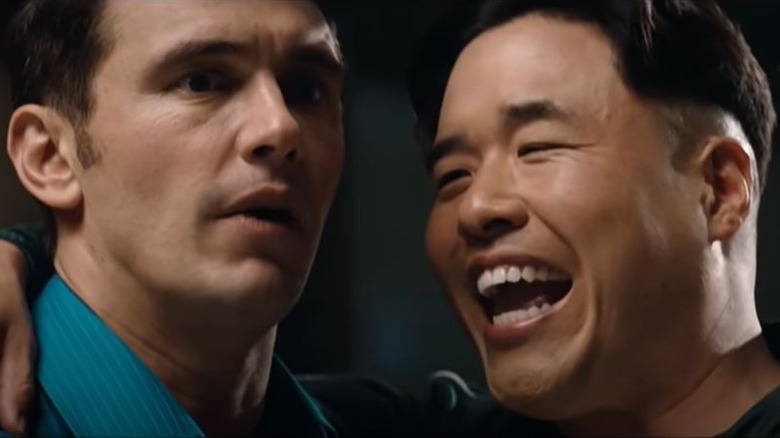 Randall Park arm around James Franco