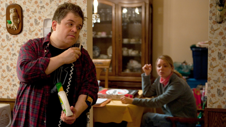 Patton Oswalt on phone, Charlize Theron sitting