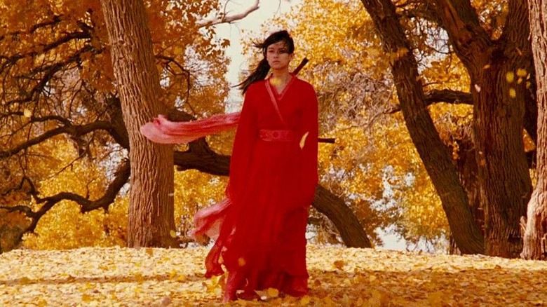 Women in red standing in forest