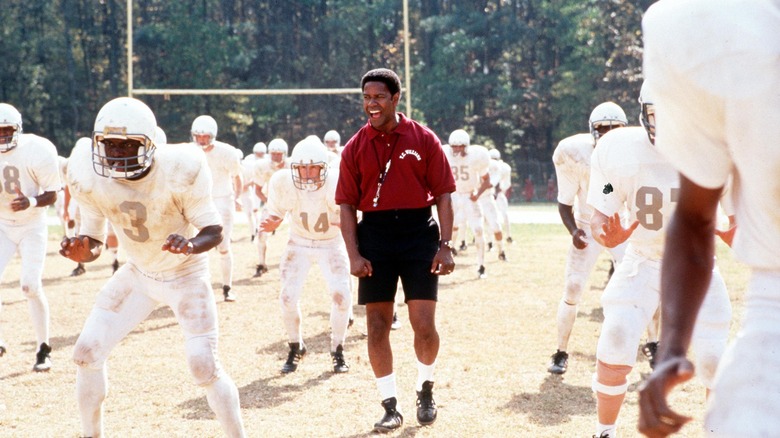 Denzel Washington with football players