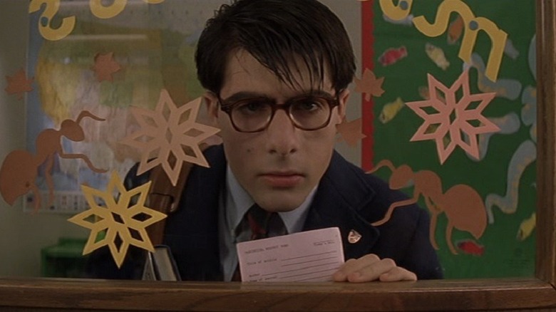 Jason Schwartzman looks through window