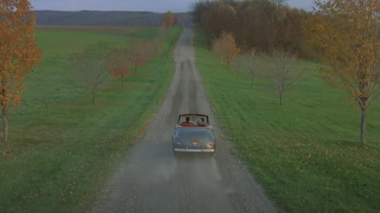 Car driving down country road